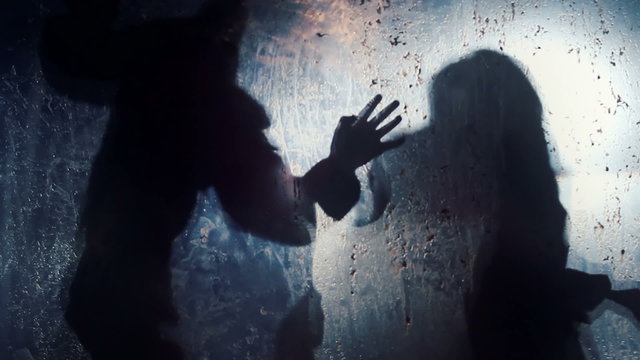 Silhouettes of angry beasts waving paws in darkness, wild supernatural creatures