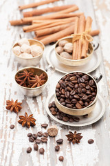 Coffee beans and spices in a vintage silver cups