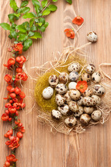 Quail eggs and flowers. Romantic Easter background
