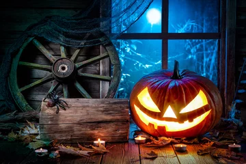 Fotobehang Halloween pumpkin head jack lantern with burning candles © Alexander Raths
