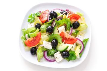 Greek salad isolated on white