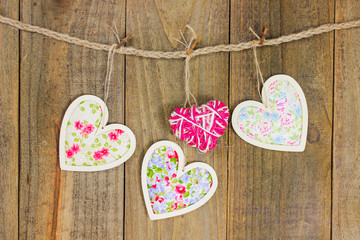 Country fabric hearts and rope heart hanging on clothesline