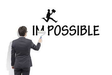 Man writing the word 'possible'