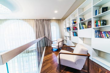 Home library with arm chair.