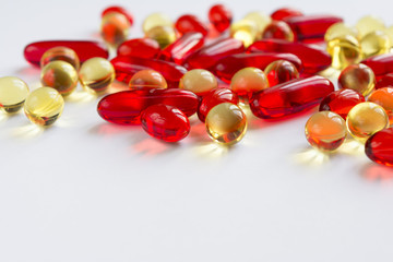 Vitamins scattered on a white background