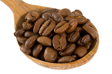 coffee beans in a wooden spoon isolated on white
