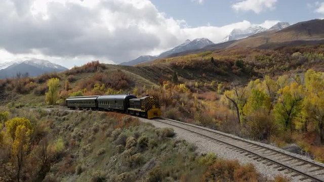 Train Rolling through Scenic Landscape
