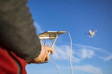 Fototapeta na wymiar Man flying with the drone 