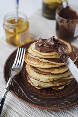 Pancakes with chocolate and honey