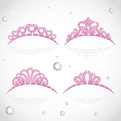 Elegant shiny pink tiara with precious stones isolated on white © Azuzl