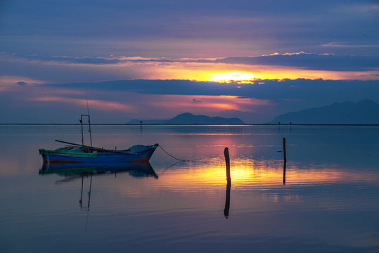 Sea and boats at sunset