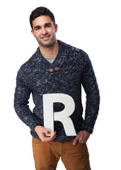 man holding a R letter