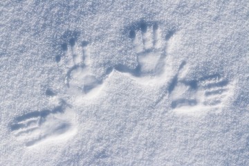 Left and right human prints in the snow.