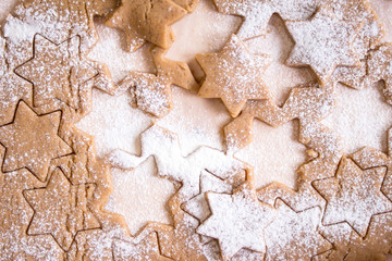 Cutting gingerbread cookies. Process of baking cookies at home.