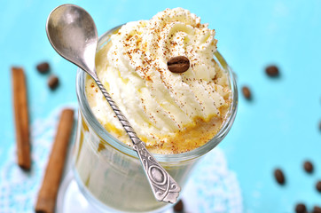 Pumpkin latte with cinnamon,caramel and whipped cream.