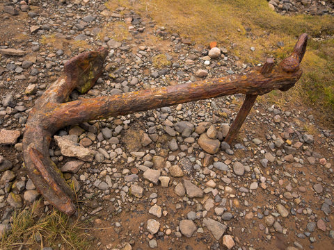 The old rusty anchor on beach, Ravenglass, Cumbria, UK