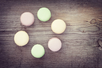 French macaroons on  old wooden background