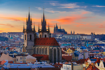 Obraz premium Aerial view over Church of Our Lady before Tyn, Old Town and Prague Castle at sunset in Prague, Czech Republic 