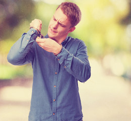 angry young man with handcuffs