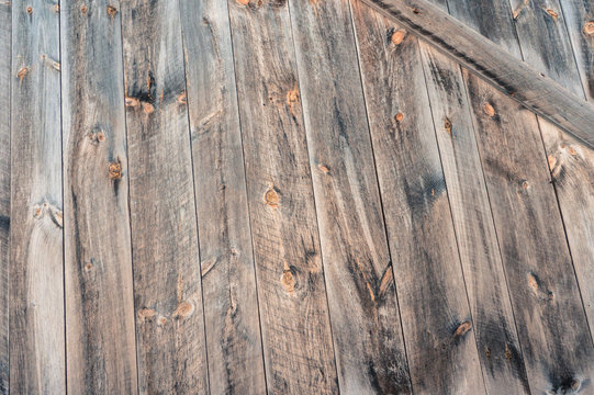 wood boards on barn with knots and and grey weathering