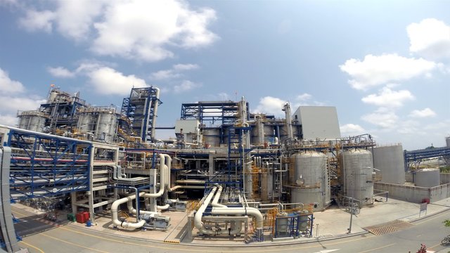Oil Refinery plant with cloudy sky , Time lapse