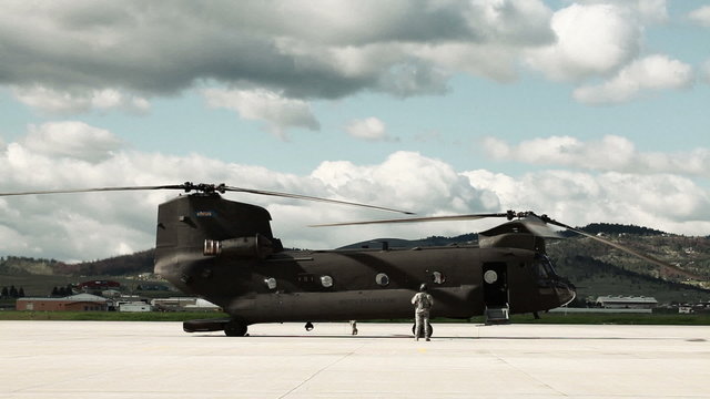 Time lapsed, CH-47 Chinook Helicopter at an airfield.