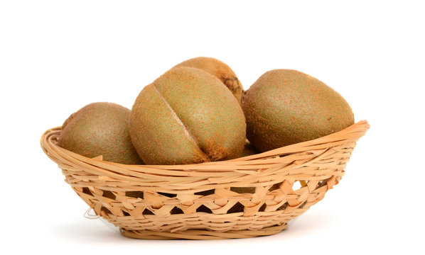 Fresh kiwi in a basket isolated on the white background