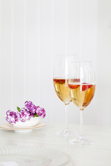 Glasses of sparkling wine on table