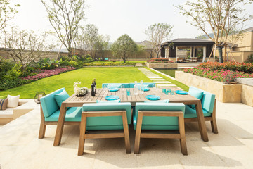 elegant chairs and table in backyard