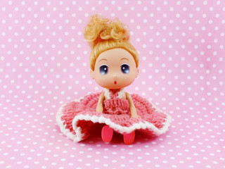 baby doll pink dress isolated on pink polka background
