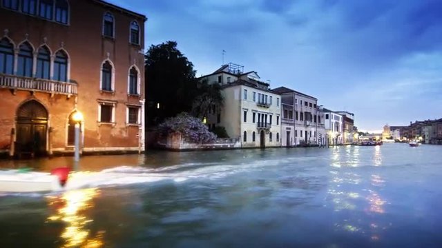 Tracking shot of happenings on the Grand Canal at dusk