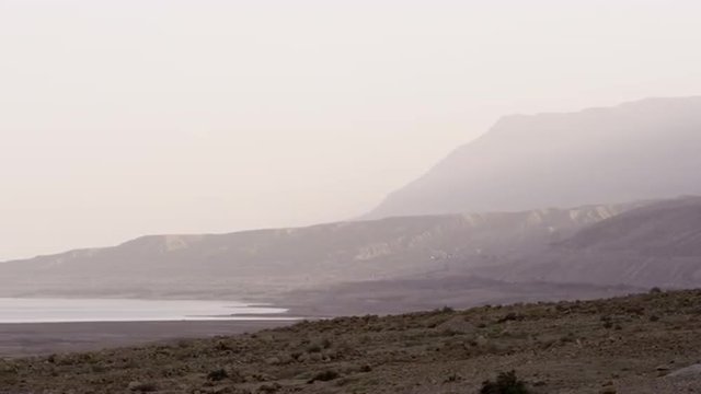 Royalty Free Stock Video Footage of a hazy Dead Sea shoreline shot in Israel at 4k with Red.