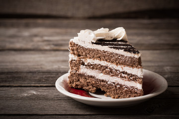 Piece of cake on the wooden table