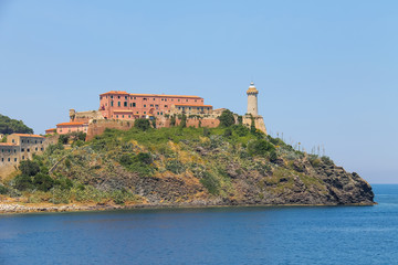 Fototapeta na wymiar The lighthouse on the hill in Portoferraio, the main port of Elb