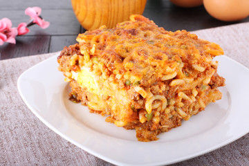 Baked pasta with peas, eggplant and egg