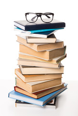 Pile of books on white background