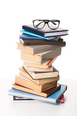 Pile of books on white background
