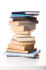 Pile of books on white background