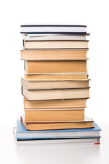 Pile of books on white background
