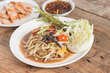 Som Tam is spicy green papaya salad, Thai food.