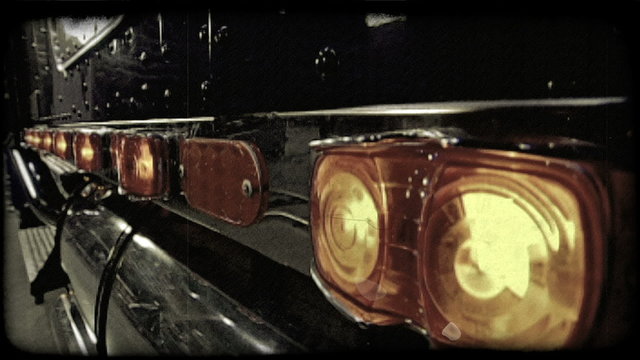 Row of truck lights. Vintage stylized video clip.
