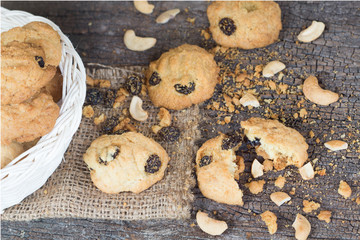homemade oatmeal cookies with cashew on old Cracked Wood Backgro