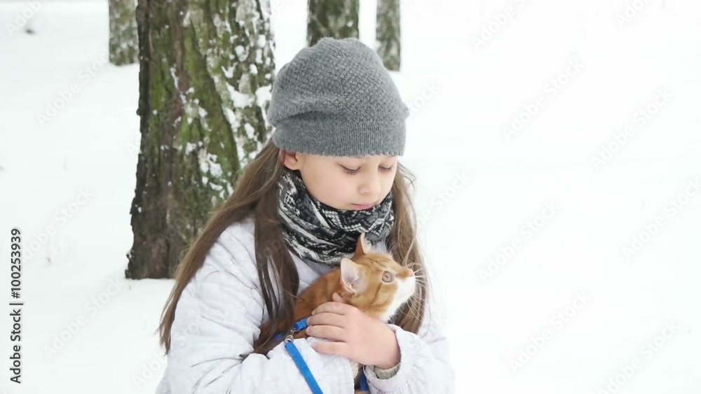 Wall mural girl and a cat for a walk in the park