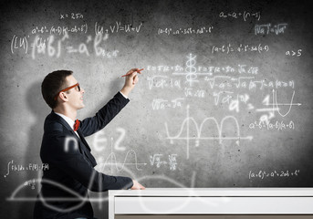 Student drawing science formulas