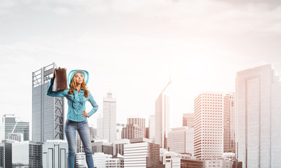 Attractive girl with old suitcase