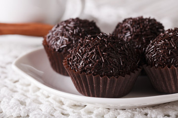 Brazilian sweetness Brigadeiro on a plate macro. horizontal
