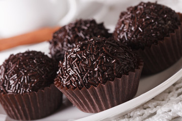 Brazil Brigadeiro candy on a plate macro. horizontal