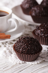 Brazilian Brigadeiro sweet and coffee macro. vertical
