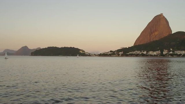 Static shot of Guanabara Bay with Sugarloaf Mountain in the distance.