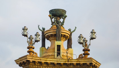 Lantern with allegorical sculptures on the square of Europe in Barcelona